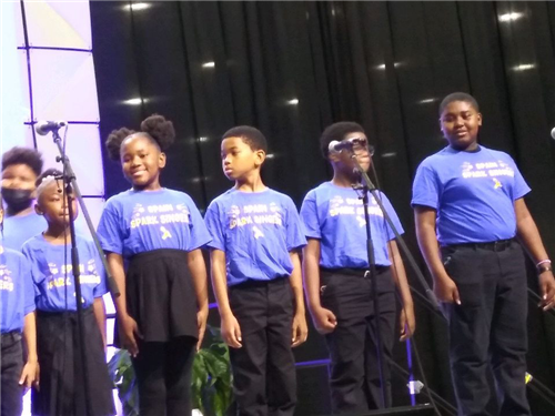 Students singing the National Anthem